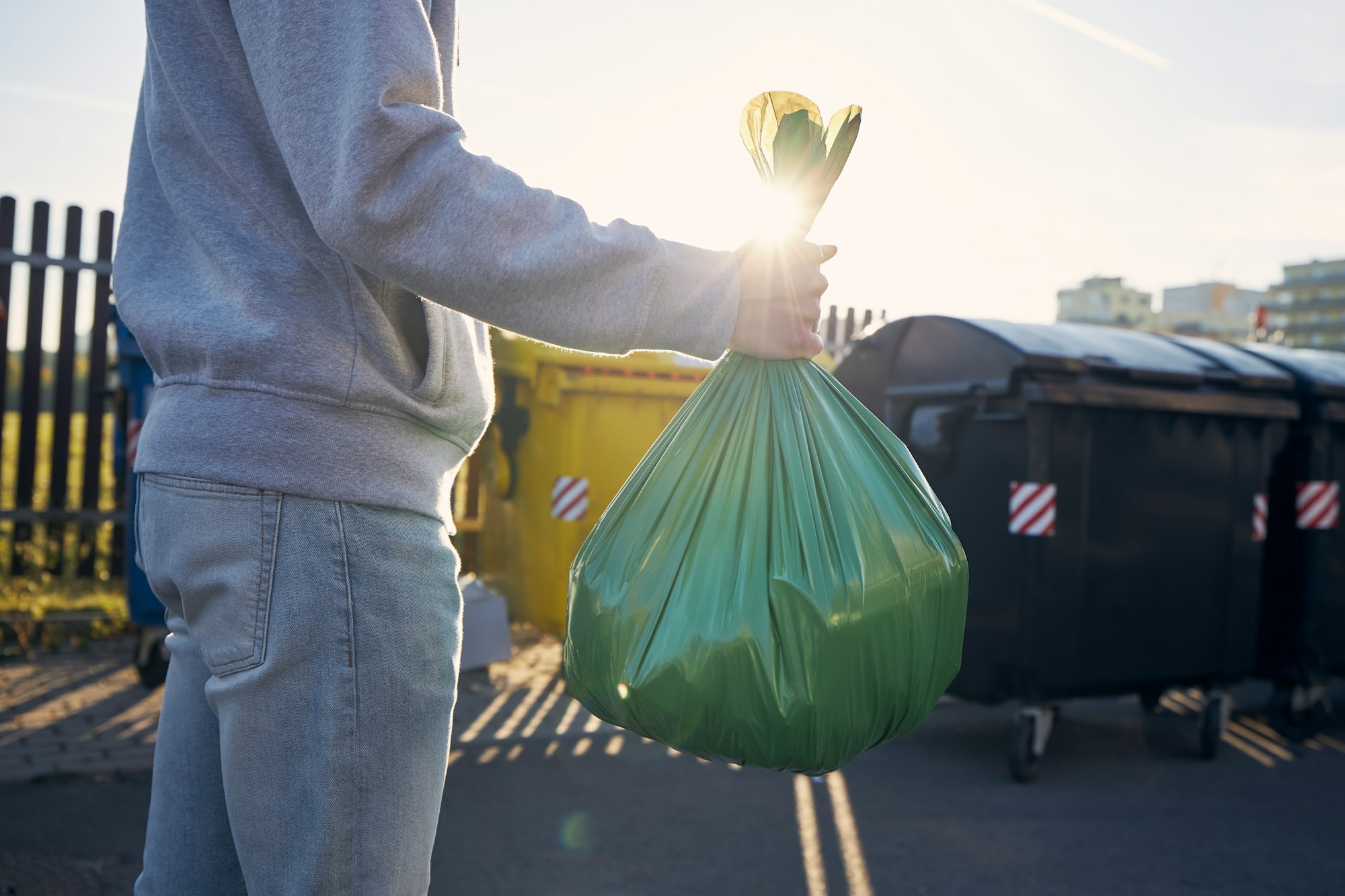 Man carrying garbage bag