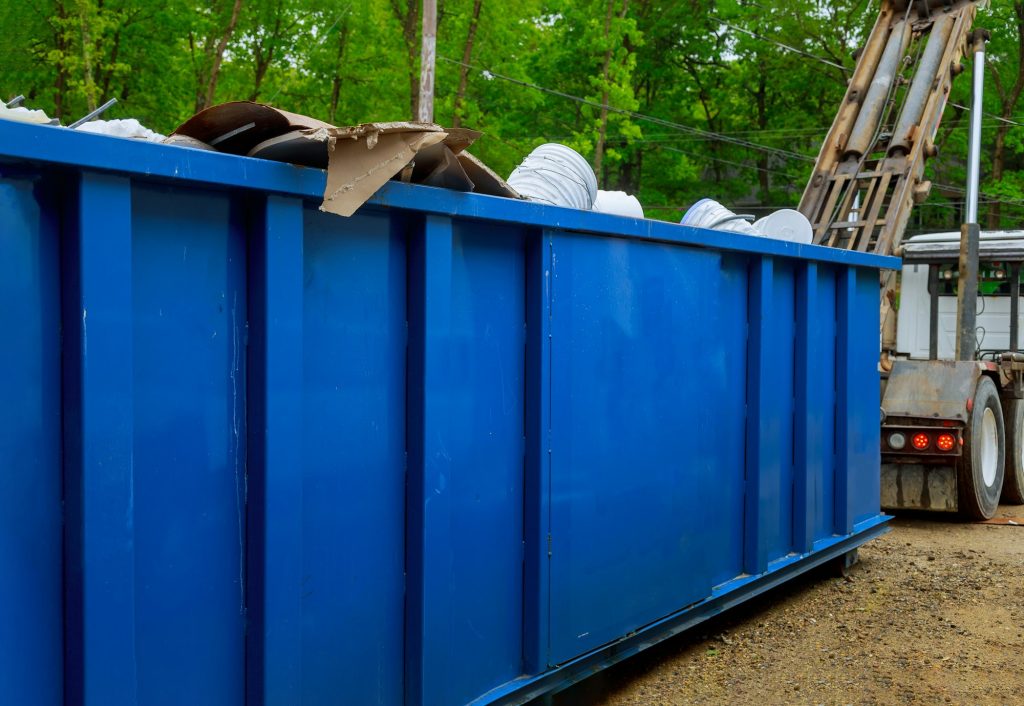 Truck loading a full recycling container trash dumpsters being with garbage container trash